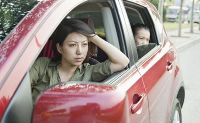 mother driving child in car