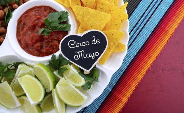 Festive Cinco de Mayo platter with chips, salsa and limes
