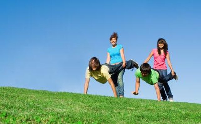 Kids playing game in grass