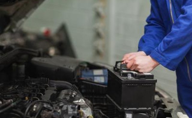 Use a hand wrench to loosen the battery terminal clamps and then remove them.