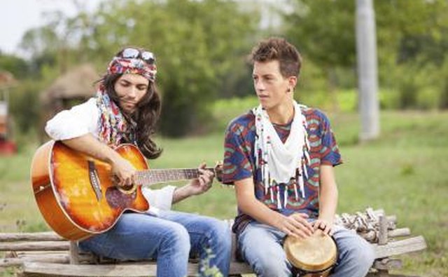 Men playing guitar and bongo drum.