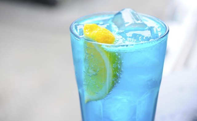An alcholic drink with blue curacao.