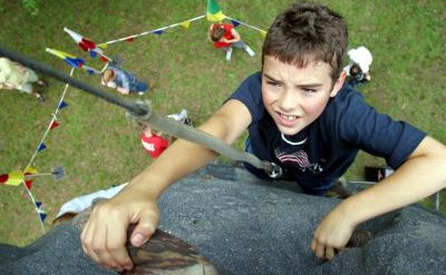 Young boy rock climbing
