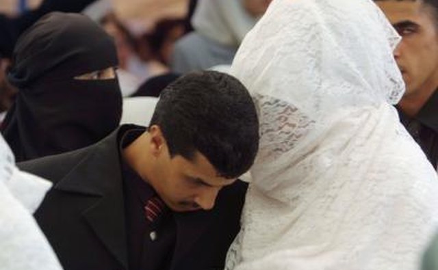 Veiled Muslim bride and groom