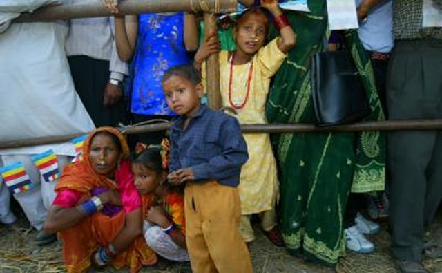Nepalese villagers watch ceremony in Lumbini, Nepal