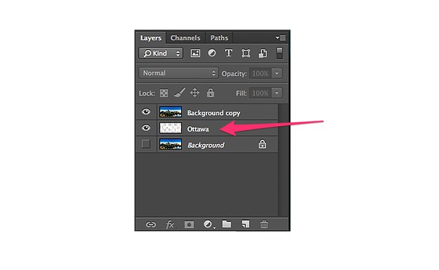 Drag the text layer below the layer with the photo.
