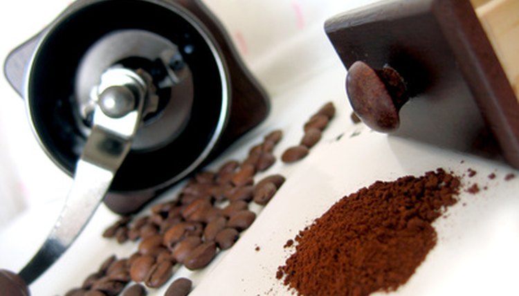 Coffee grinder, beans and ground coffee image by Angel_a from Fotolia.com