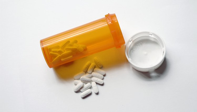 pills and pill bottle image by Effie White from Fotolia.com