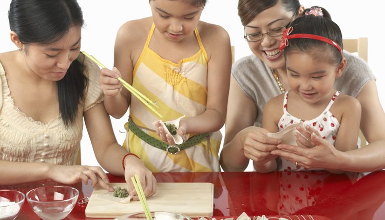 Mothers and daughters (3-9) making wonton dumplings