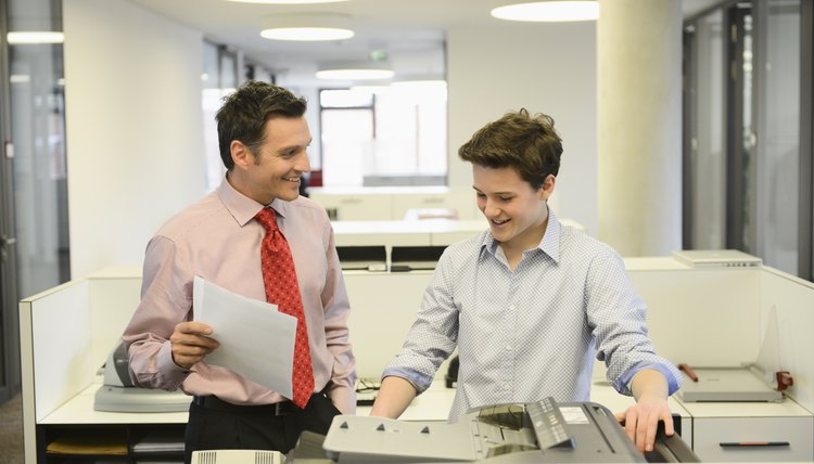 Teenage boy and businessman in office
