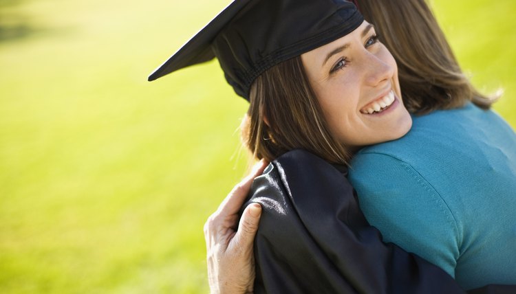 Graduate and mother embracing