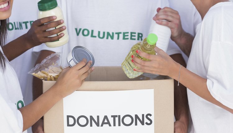 Volunteer with food donations.