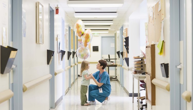 Doctor with girl in hospital