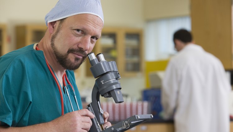 Scientist with a microscope in a laboratory