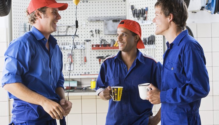 Mechanics conversing in garage