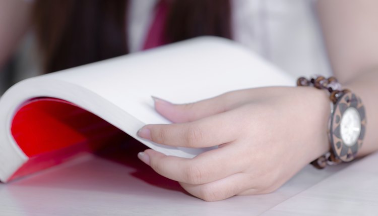 closeup hand open book for reading