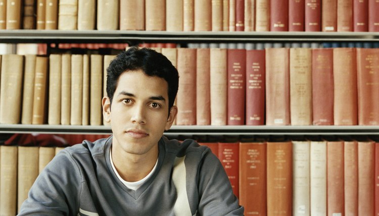 Smiling college student in library.