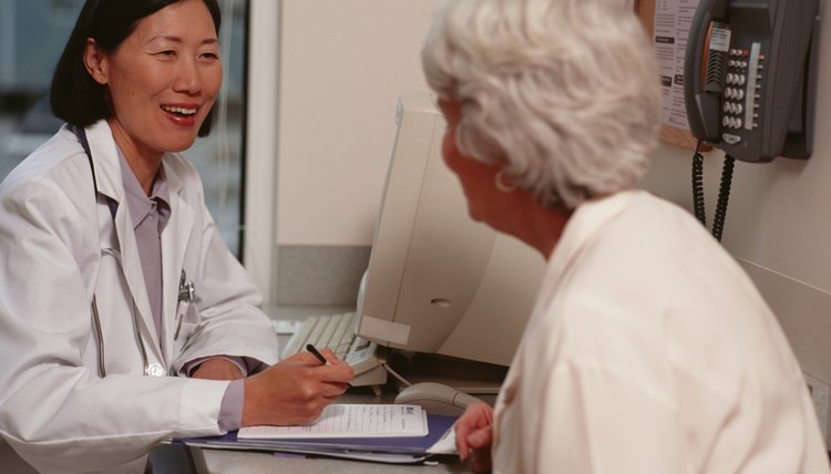 Senior woman sitting at doctors clinic