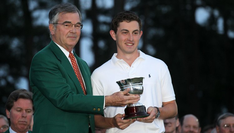 Patrick Cantlay (right) receives an award as the low amateur player at the 2012 Masters. The trophy did not violate Cantlay's amateur status.