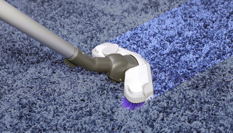 The metal pipe of vacuum cleaner in action