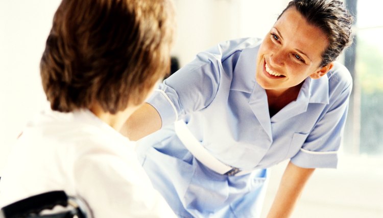 young female nurse talking to a patient in a wheelchair