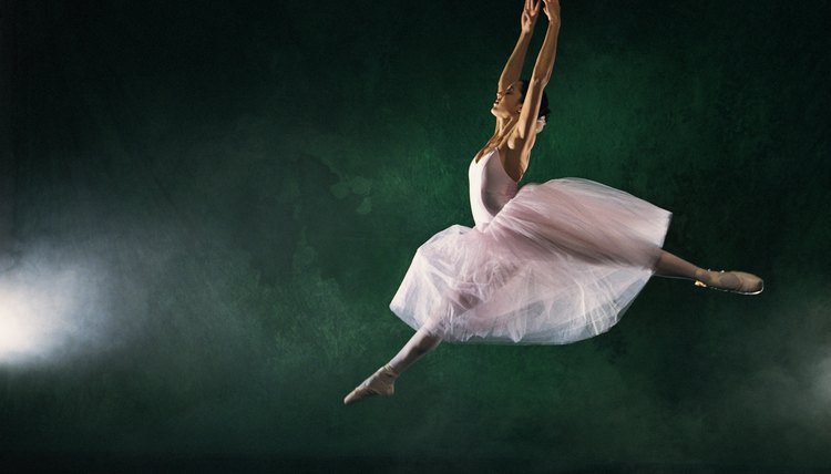 Ballerina leaping across stage
