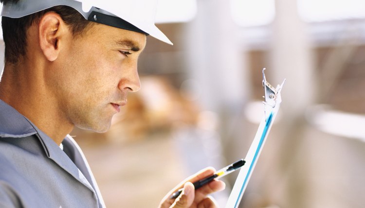 close-up of a construction worker wearing a hardhat at a construction site