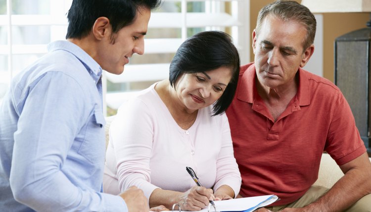 Financial Advisor Talking To Senior Couple