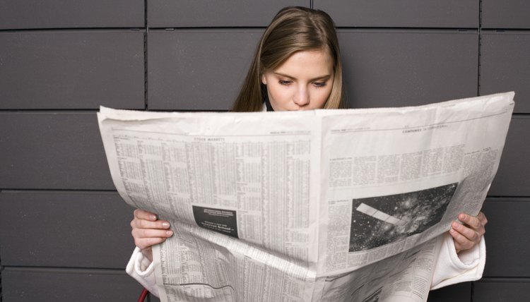 Woman reading newspaper