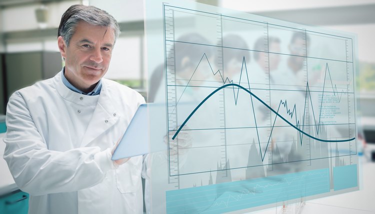 Confident scientist working with tablet and futuristic interface showing graph