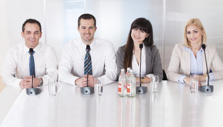 Group Of Business People Sitting In Conference