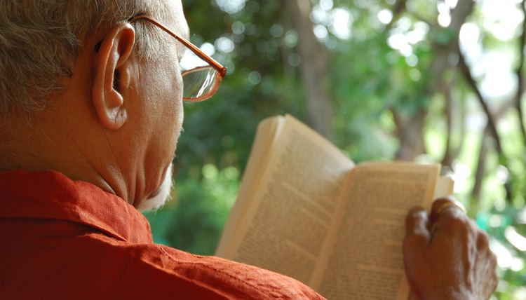 Old man reading a book