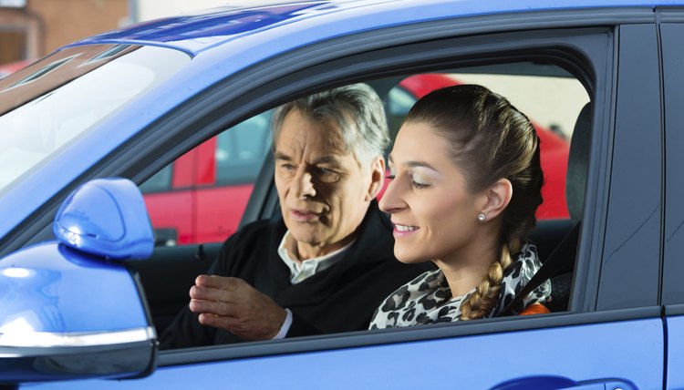 Young woman at driving lesson