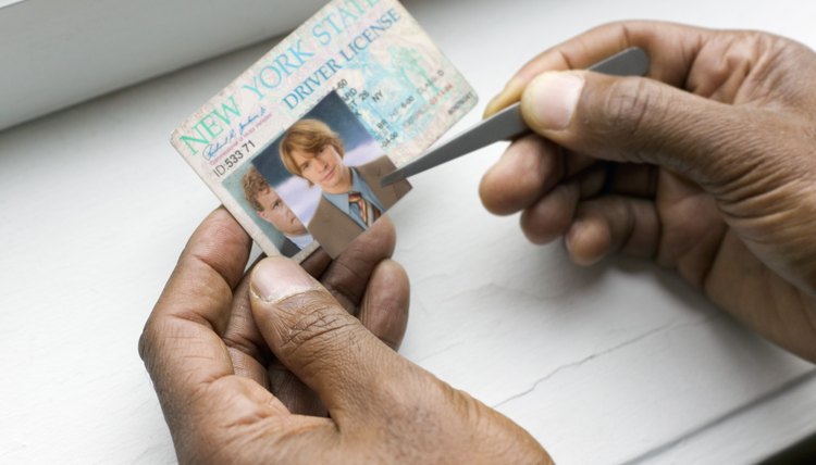 Hands making fake ID