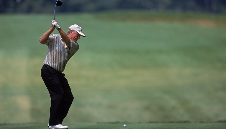 Jack Nicklaus flexes his left knee during his backswing, forcing his left foot and ankle to turn along with the knee.