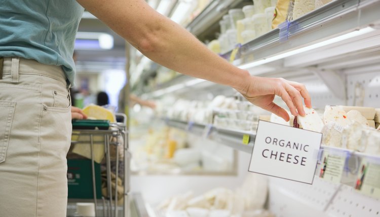 Person shopping for organic cheese
