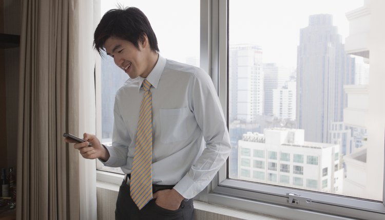 Chinese businessman using cell phone