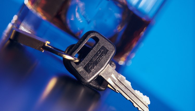 Car keys next to alcoholic beverage