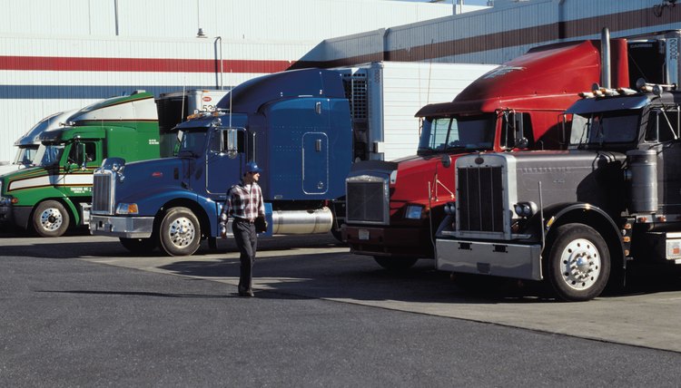 Tractor trailers at fuel station or loading dock