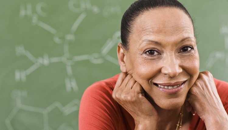 Portrait of teacher in front of chalkboard