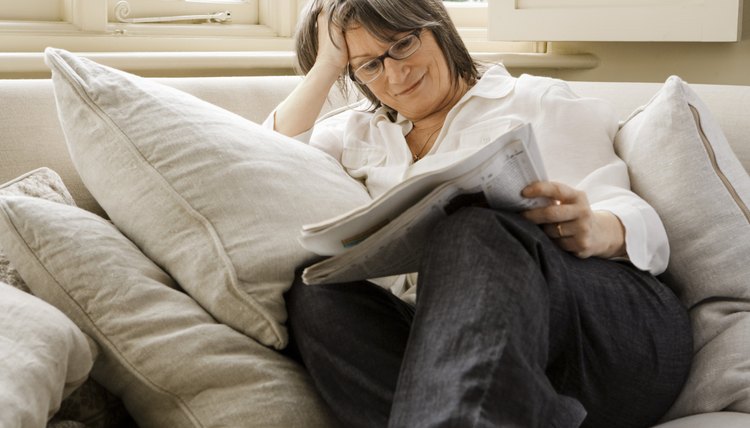 Woman reading newspaper