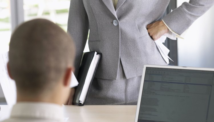 Businesswoman dissatisfied with businessman's performance