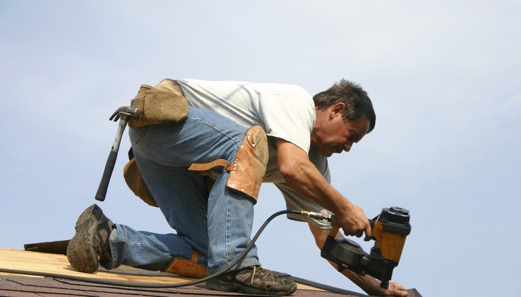 roofer - man repairing roof