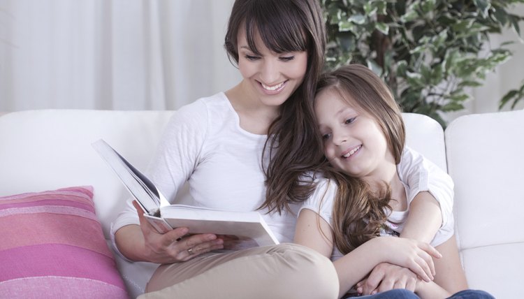 Mother and child reading picture book