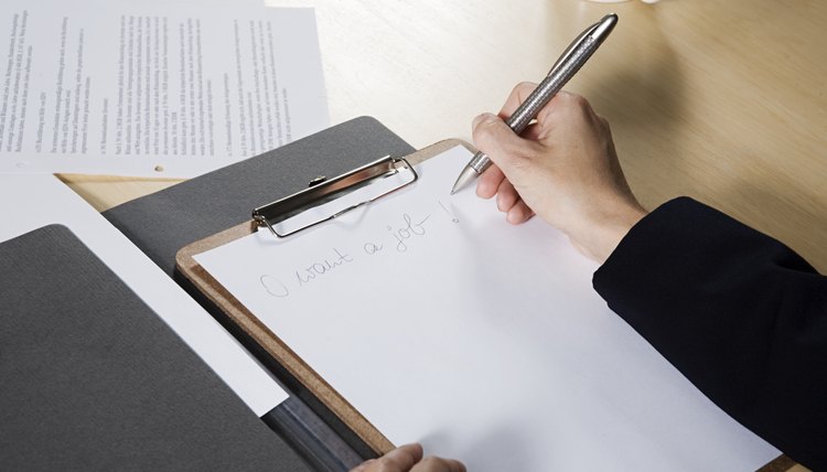 Woman writing on paper