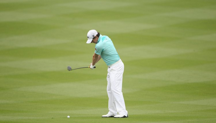 Good players like Rory McIlroy use a one-piece takeaway to get their club on plane early.