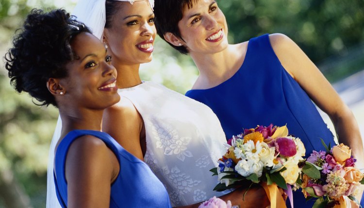 Bridesmaids work with the maid of honor to support the bride on her big day.