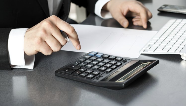 Businessman in office at the computer