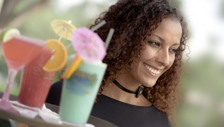African American Waitress Holding Tray of Tropical Beverages
