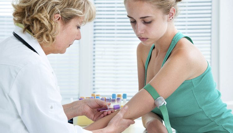 Nurse taking blood sample
